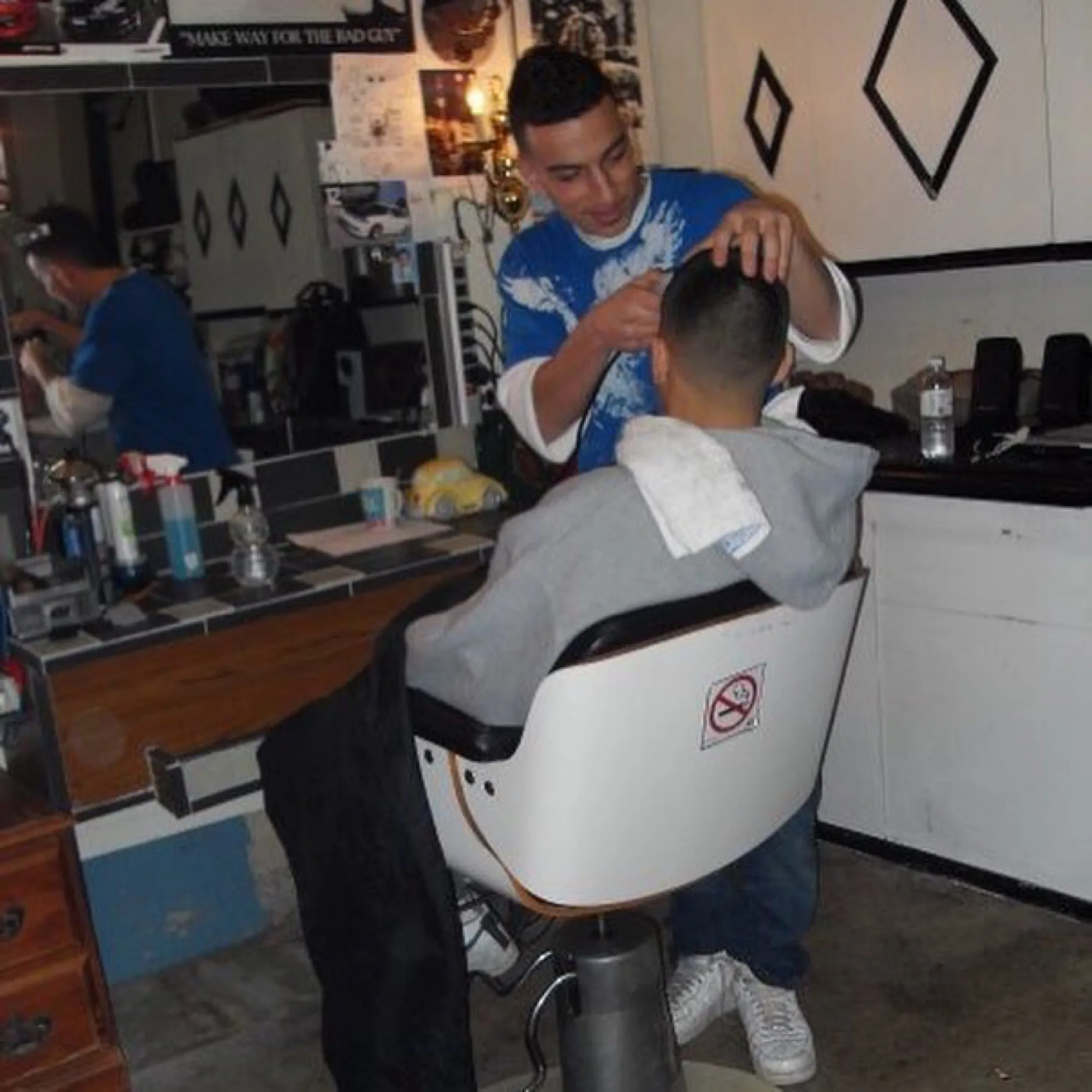 Brando in the early years cutting hair in another barber's shop